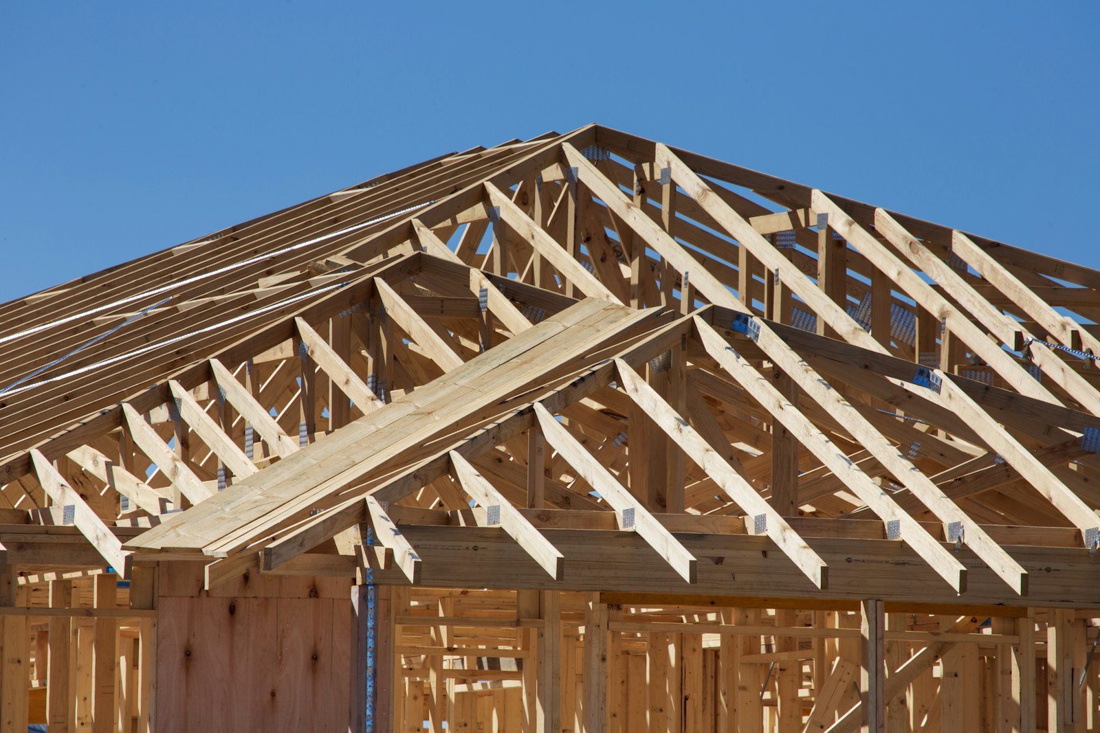 A house under construction showing its wooden framing